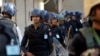 Pakistani police guard a Shi'ite procession during Muharram in Peshawar, Pakistan, Oct. 22, 2015.